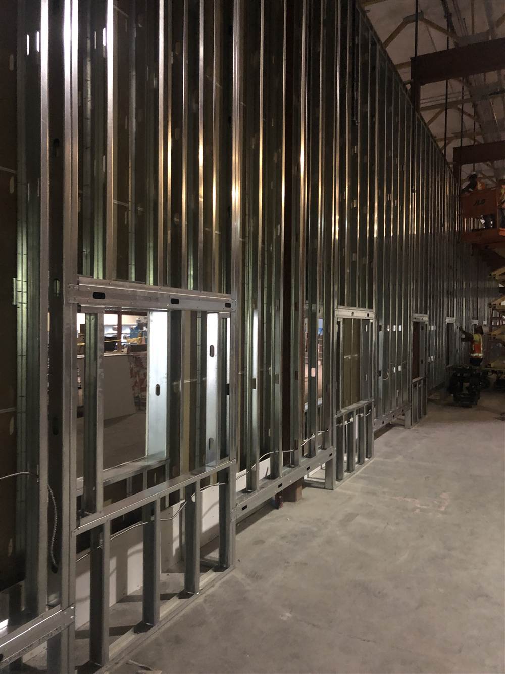 Tall steel stud wall with framed openings