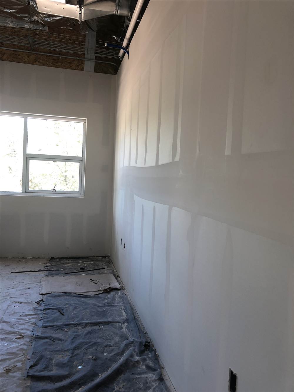 Drywall hung on a long interior wall